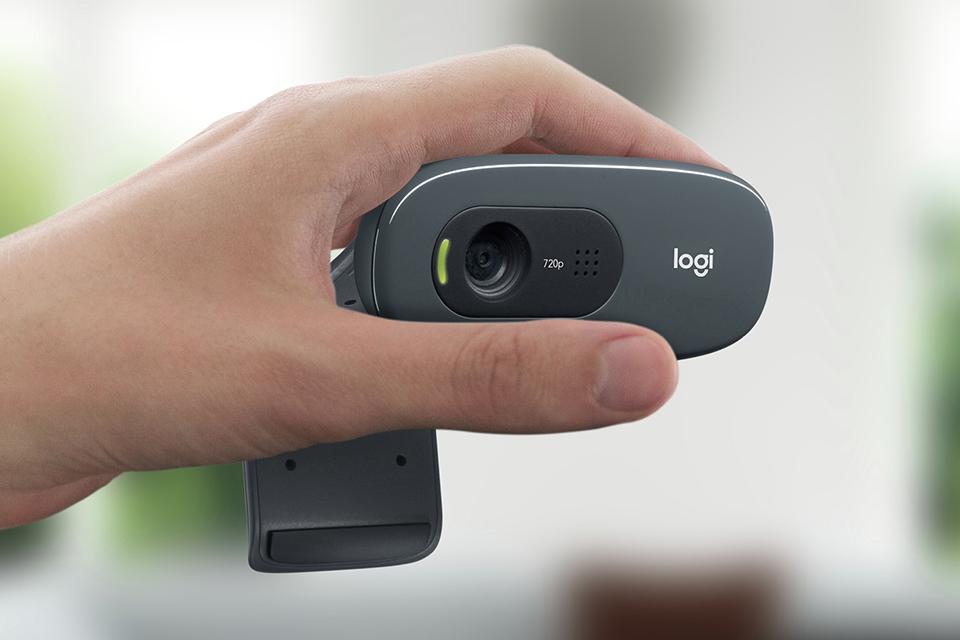 Close up of hand holding webcam