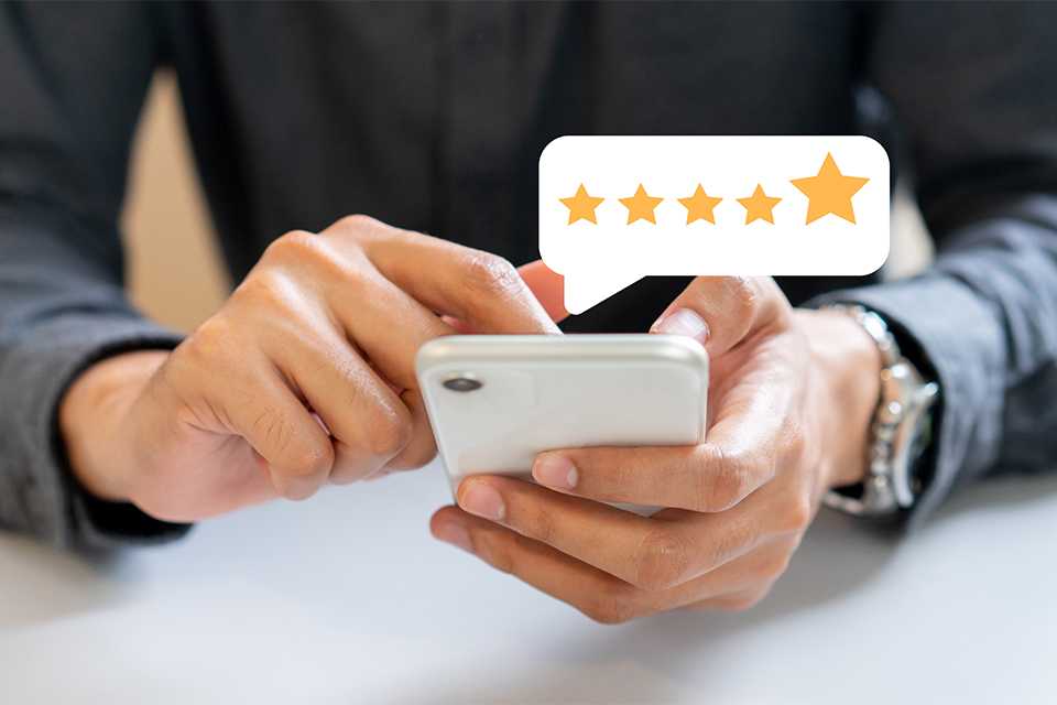 Customer using his phone to leave a review.