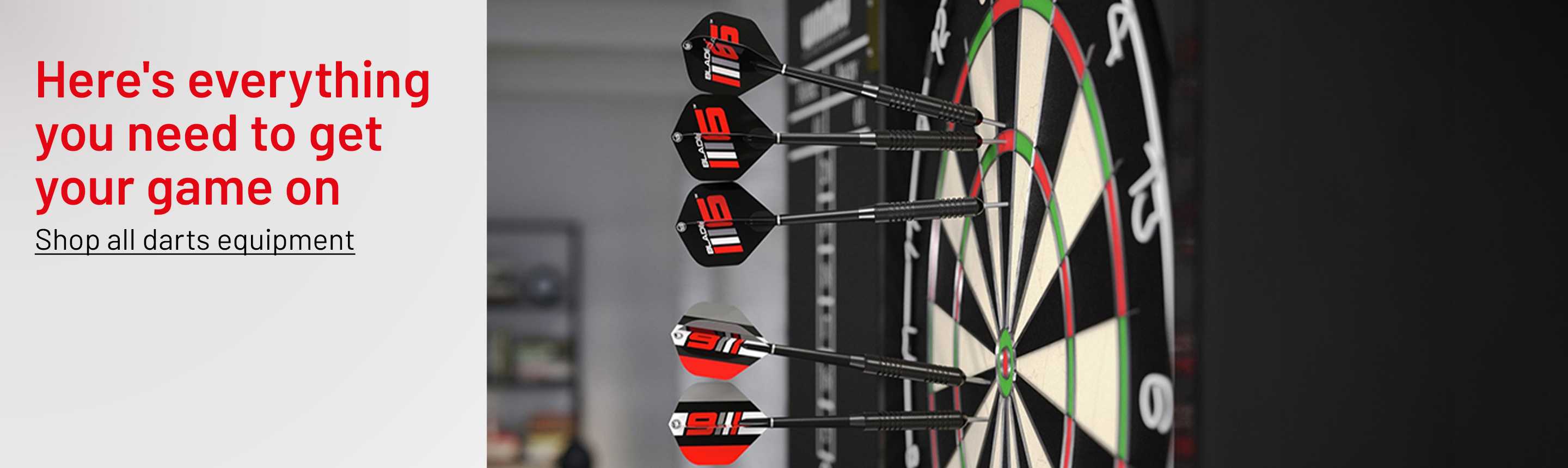 Winmau Blade 6 championship dartboard and darts set.