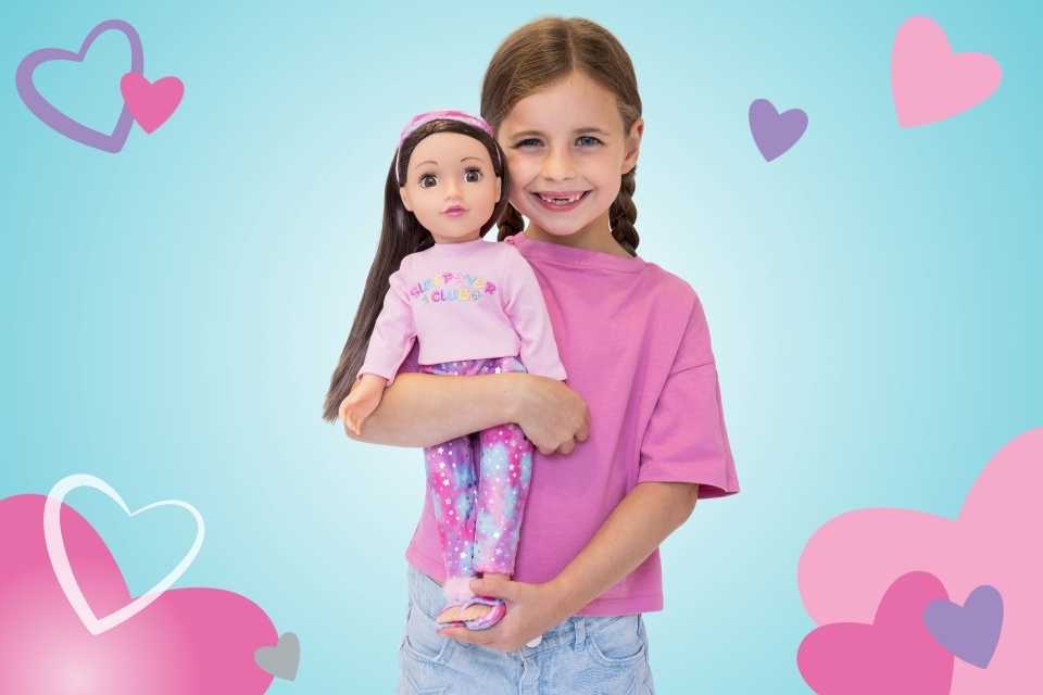 Young girl smiling and cuddling her 18" DesignAfriend doll highlighting the dolls soft, huggable body.