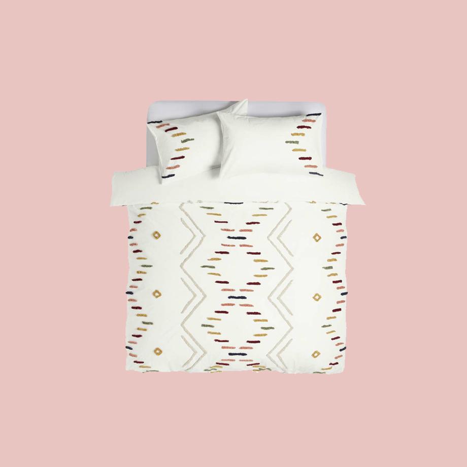 White bedding with patterns.
