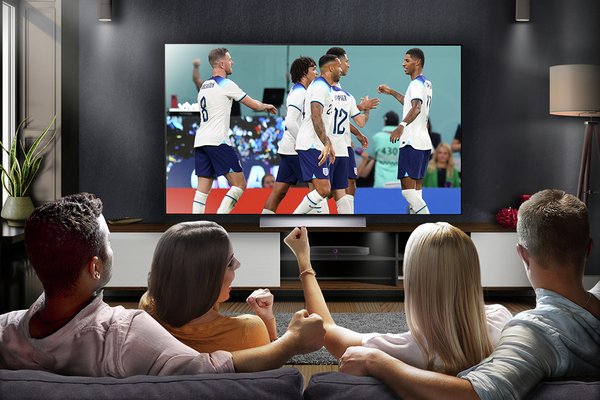 A group of friends watching football on LG 55 Inch OLED55C36LC Smart 4K UHD HDR OLED Freeview TV.