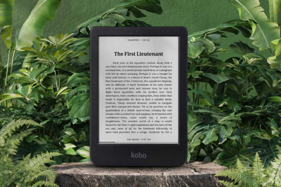 A Kobo device set against a lush green background.