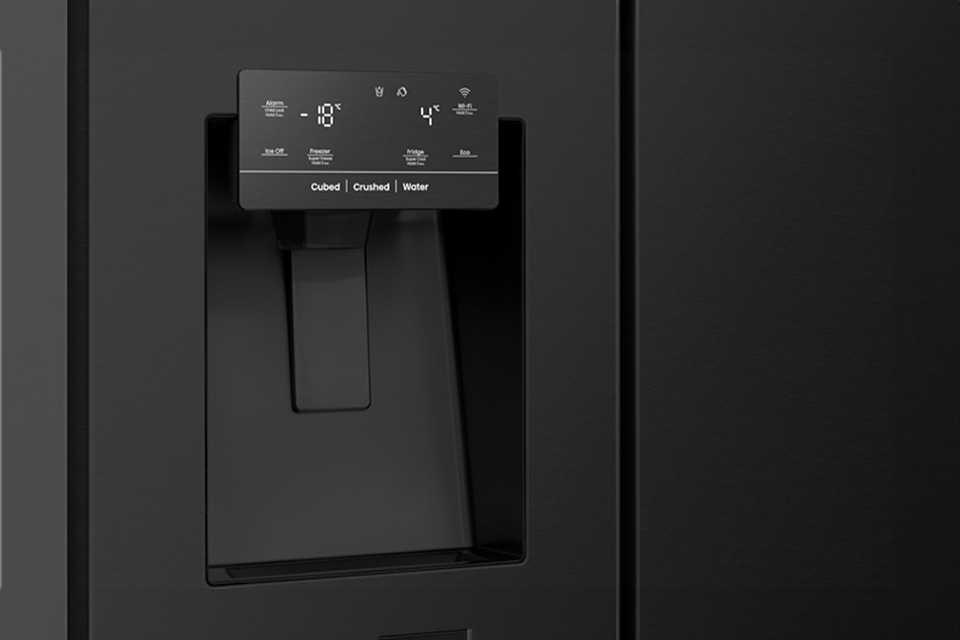 A close-up shot of a water and ice dispenser in a Hisense fridge freezer.