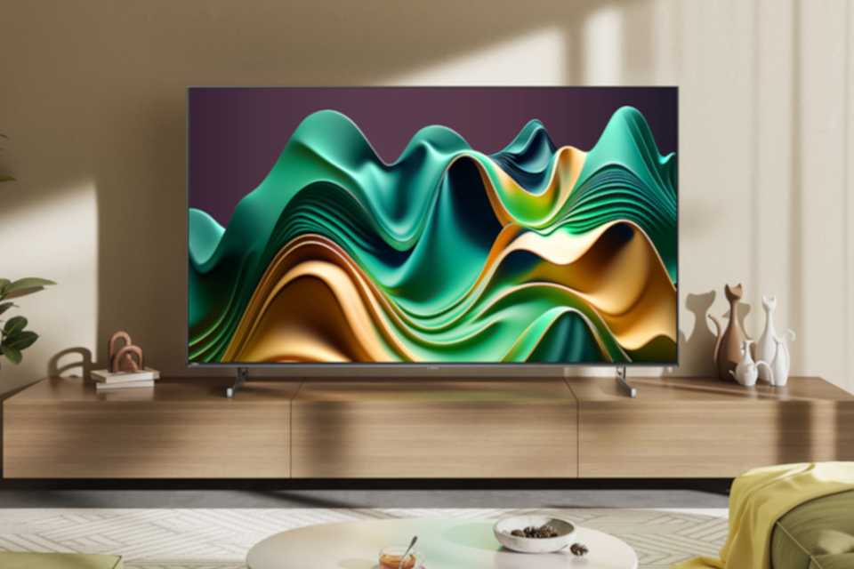 A Hisense U6N Mini-LED 4K TV stood on a TV unit in a living room.