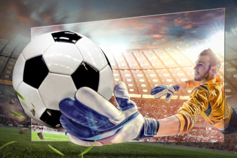 A 3D shot of a footballer holding a football on Hisense TV screen.