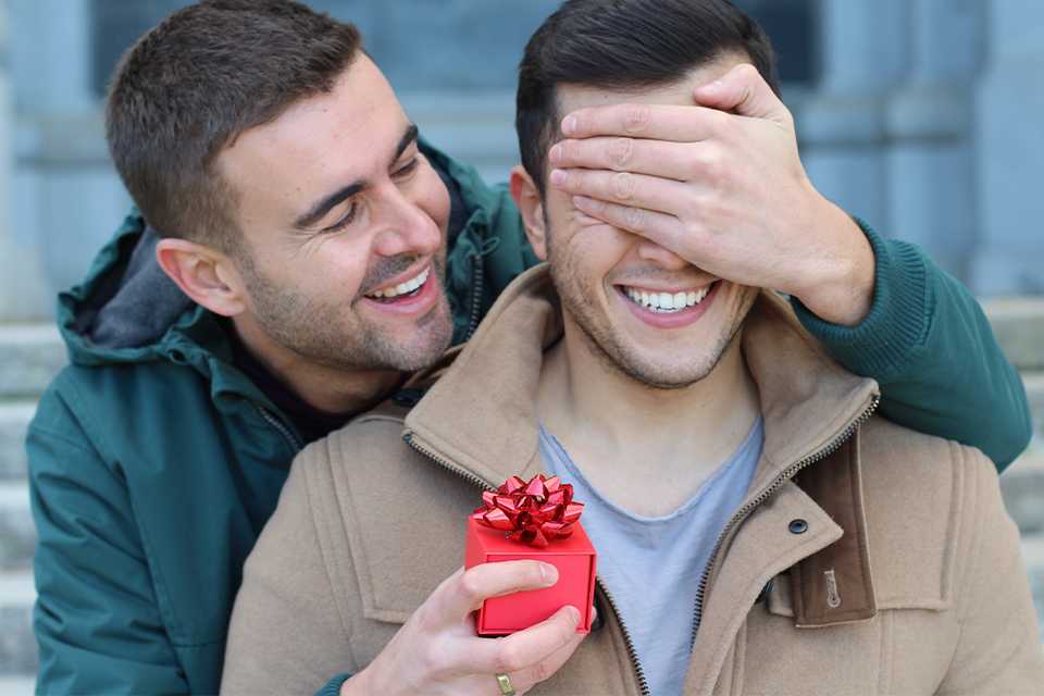 A partner surprising the other with a gift.