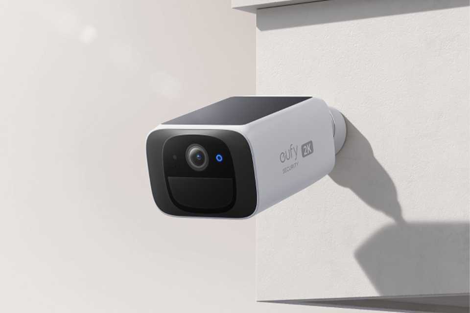 A eufy CCTV camera switched on and anchored on a wall.