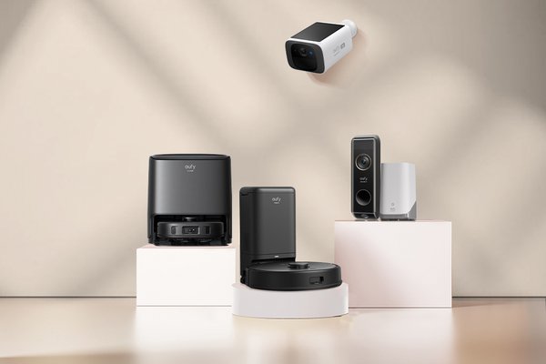 Eufy camera, doorbell system and robot vacuum photographed aesthetically.