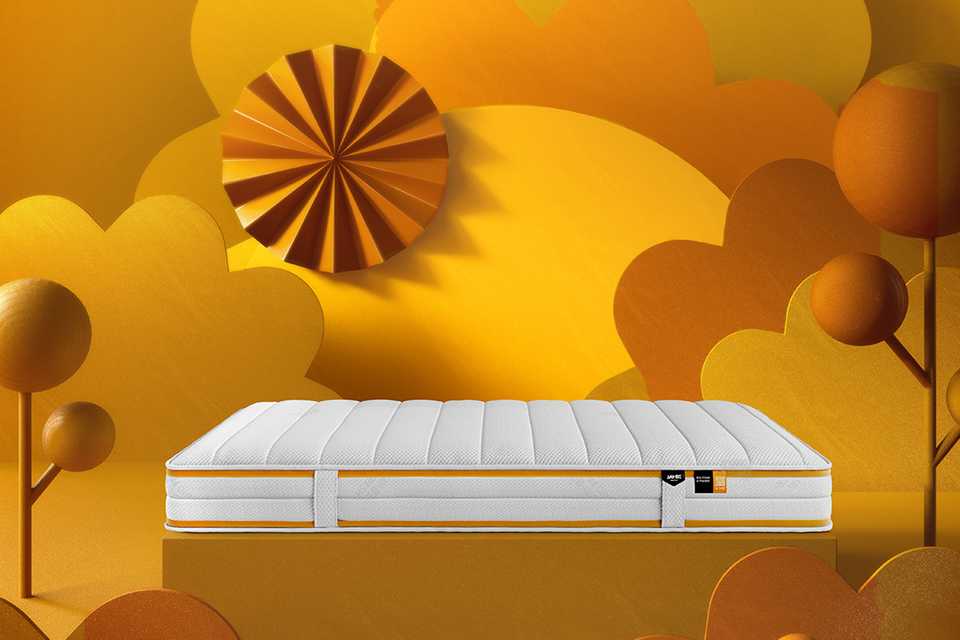 Jay-Be® Bio Fresh hybrid mattress against an orange animated background.