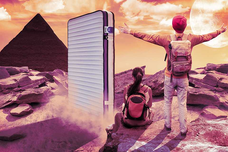 Two children in an animated mountain setting with a Jay-Be® Quest kids mattress beside.