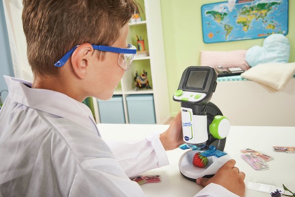 A child playing with a science toy.