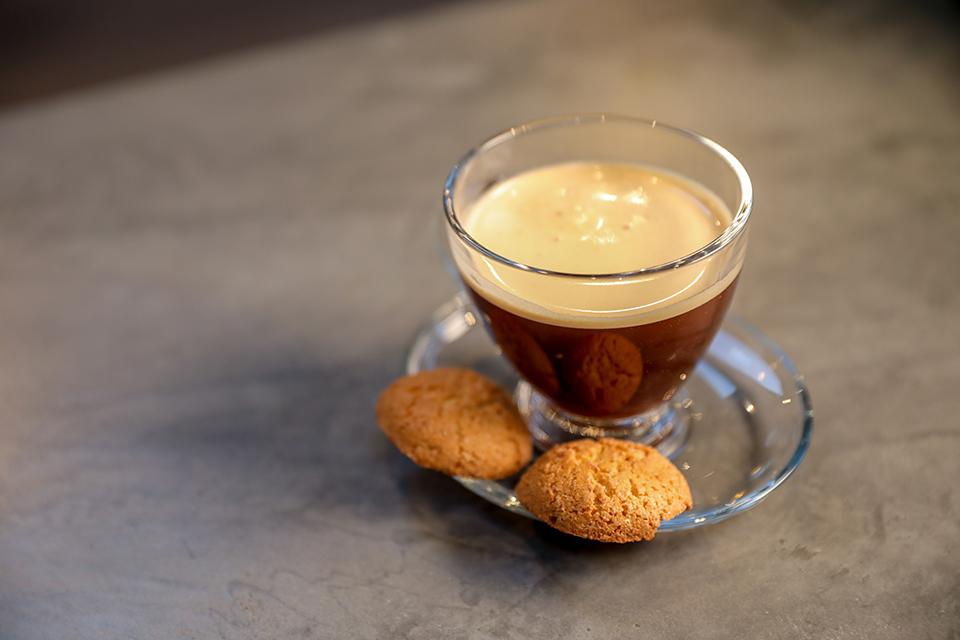 Small glass coffee cup and saucer with 2 biscuits2