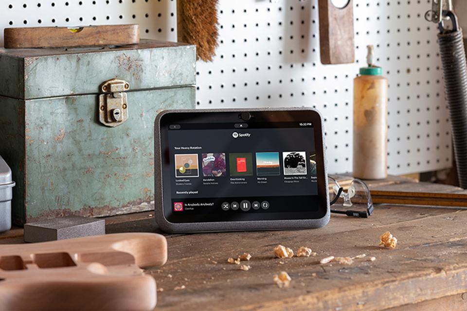 A Portal Go is shown playing music on a DIY workbench.