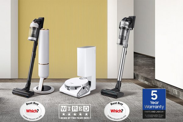Samsung cordless vacuum cleaners and other cleaning equipment placed on a grey carpet.