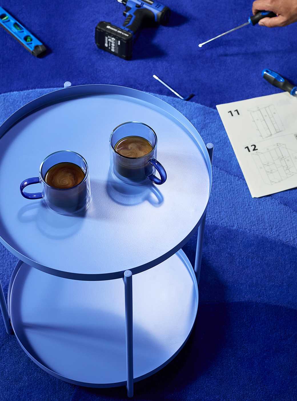 Blue mug on blue table for airtasker man's break with instructions next to it .