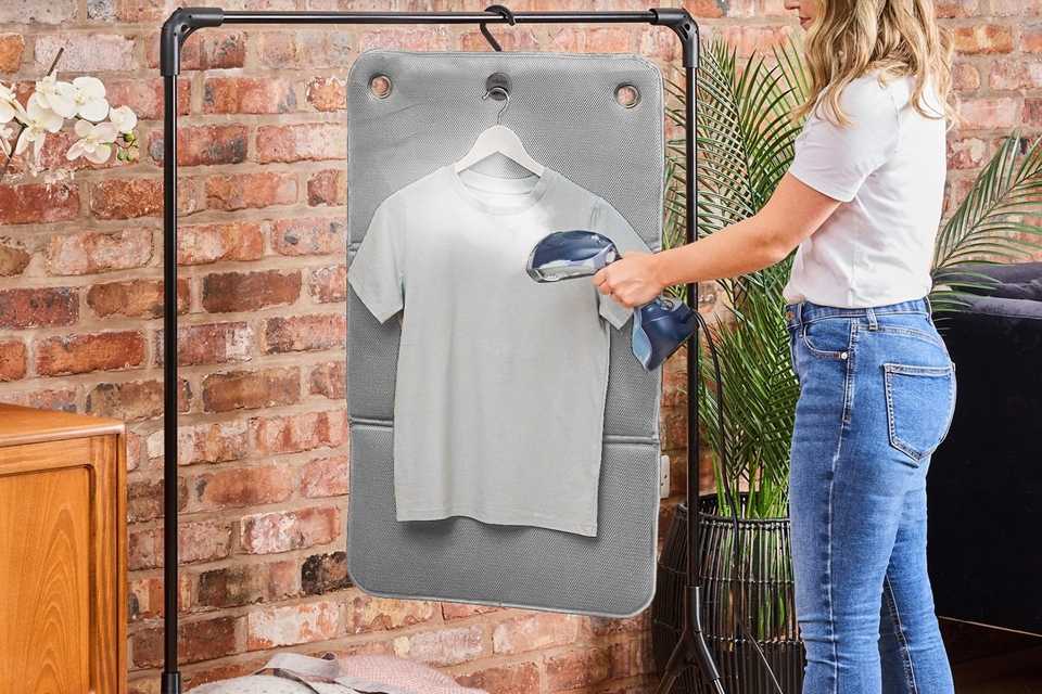 A grey Minky FlexiSteam Pad and a Argos Home Wooden Pack of 10 Hangers.