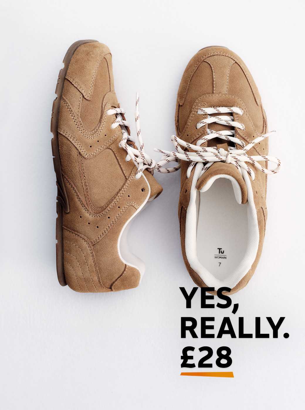 An image of tan suede panelled trainers.