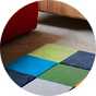 A room decorated with a colourful Habitat Archive Patch Wool Rug - 120x170cm.