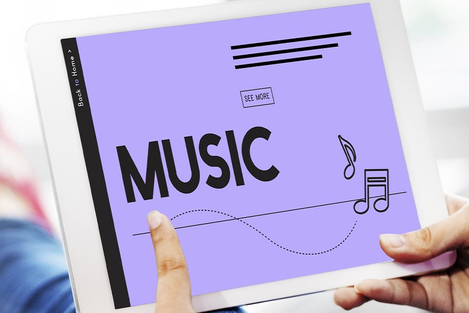 Someone searching for songs on a iPad.