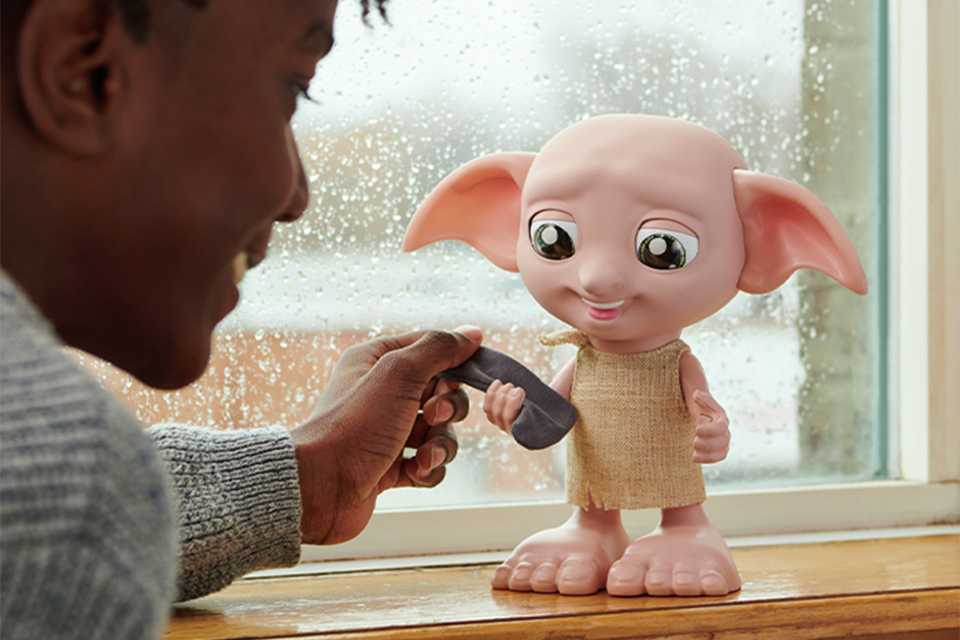 A child playing with Wizarding World Harry Potter Interactive Dobby.