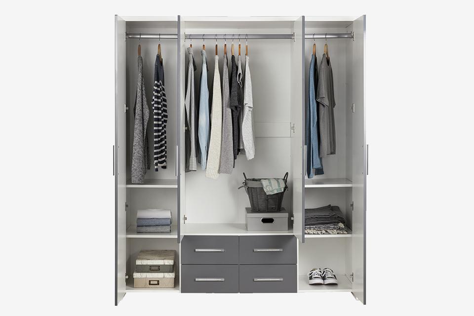 Triple wardrobe with clothes and shoe storage.