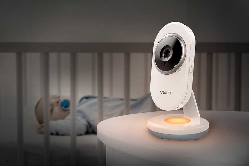 Vtech VM3254 -2 Video Baby Monitor placed next to a sleeping baby in a nursery.