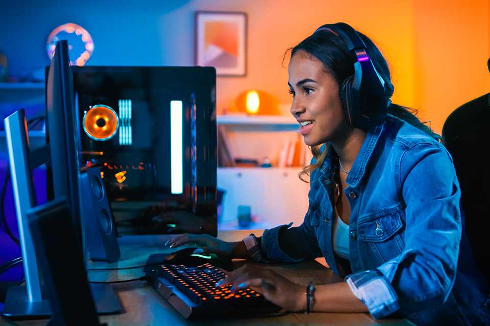 A girl playing games on her computer.