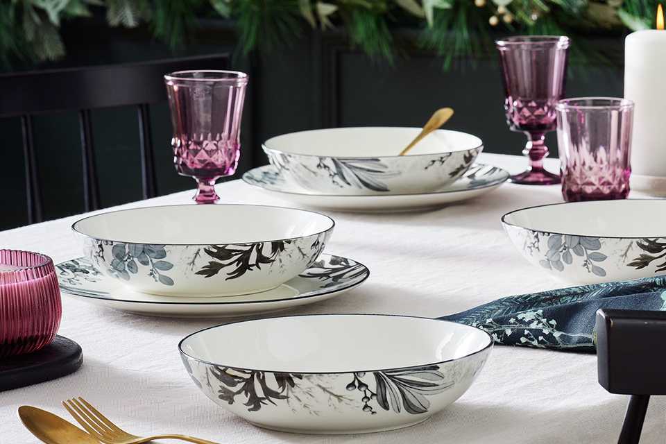 A Habitat monochrome fine China dinner set.