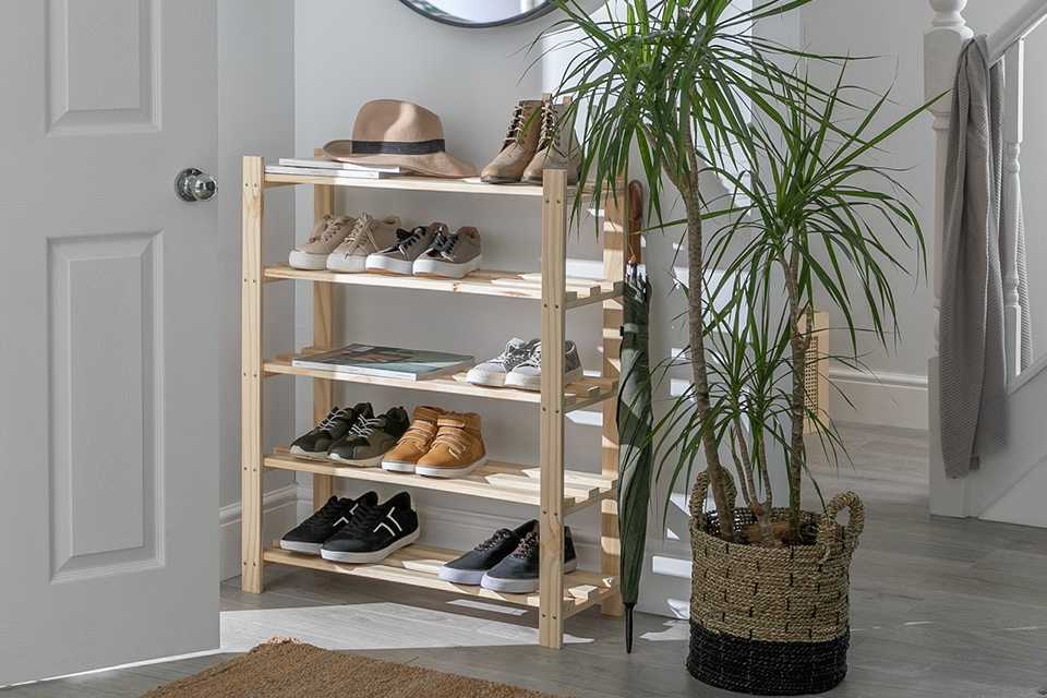 An open shoe rack in the hallway.