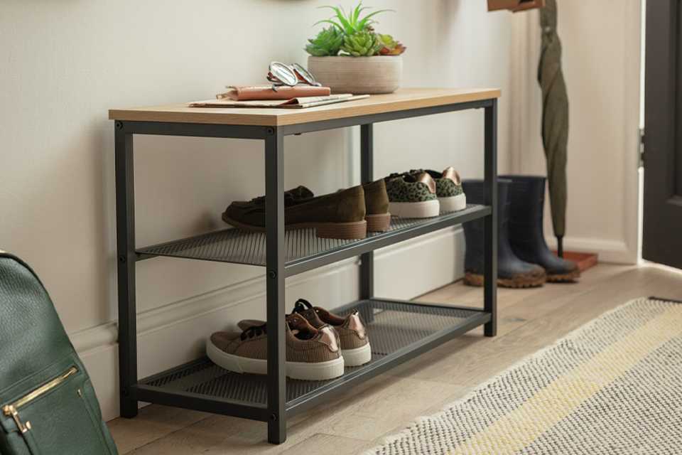 An Argos Home Loft Living 3 Tier Shoe Rack in oak and black.