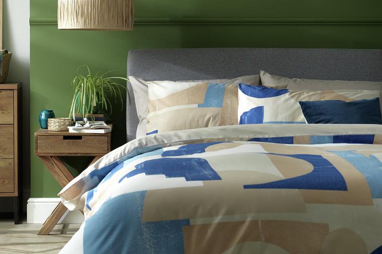 Bedding set on a grey bed.