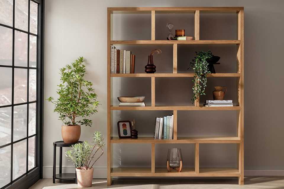 A Habitat Hopkins tall bookcase in oak colour.