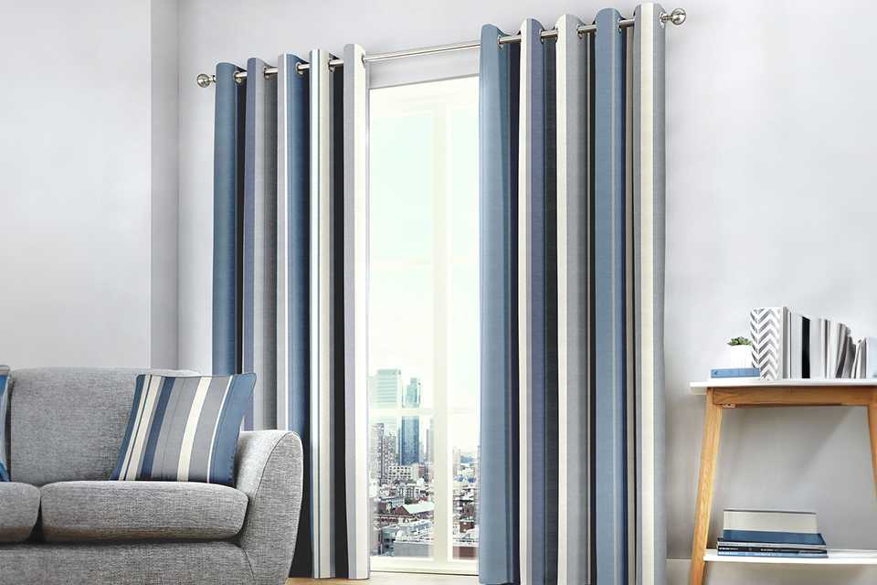 A pair of Fusion Whitworth fully lined eyelet curtains.