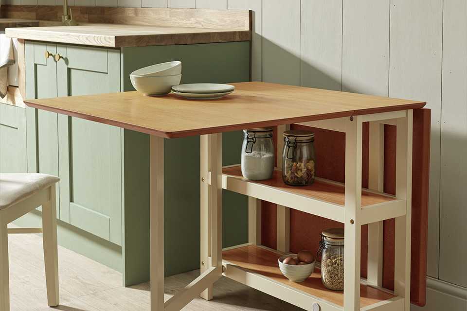 A wooden extending and folding dining table.