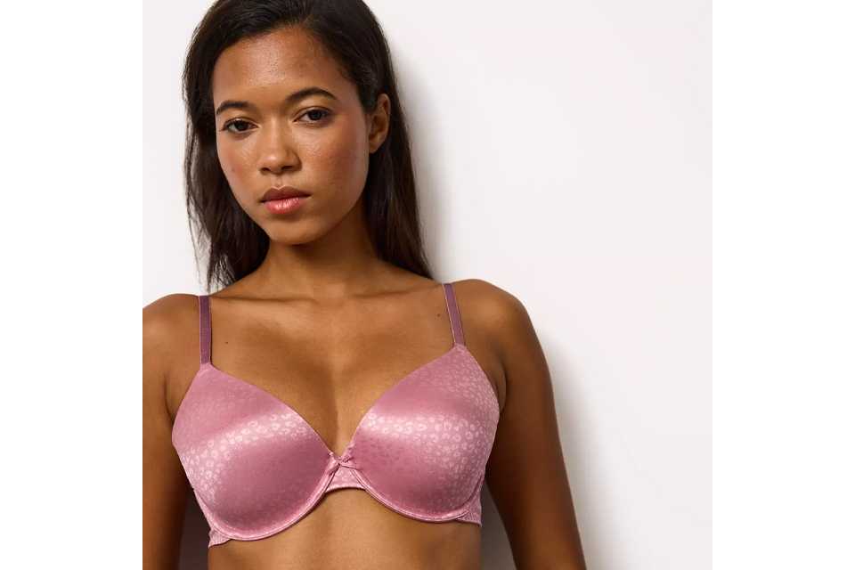 A woman wearing a pink animal print underwired bra.