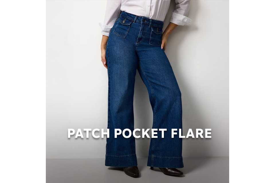 Model wearing high‑rise flared jeans with patch pockets in a relaxed fit.