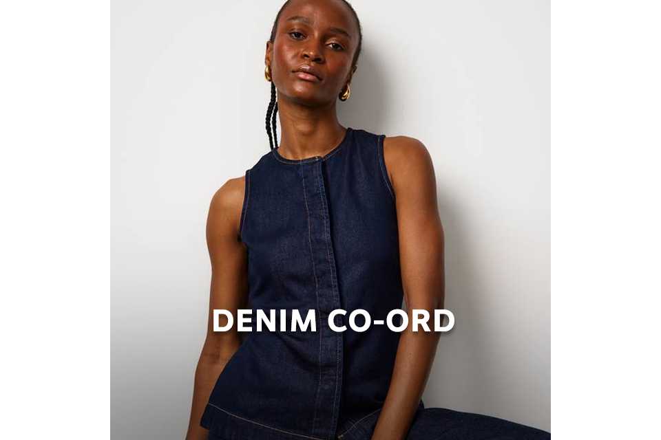 Person wearing a sleeveless dark denim co‑ord set with contrast seam detailing.