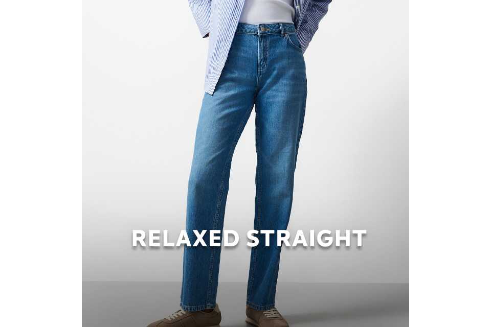 Model wearing mid‑rise relaxed straight‑leg jeans in 100% cotton denim.