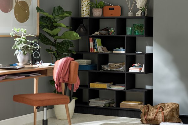 Argos Home cube 5 tier shelving black with ornaments, books, and a reed diffuser placed on it.