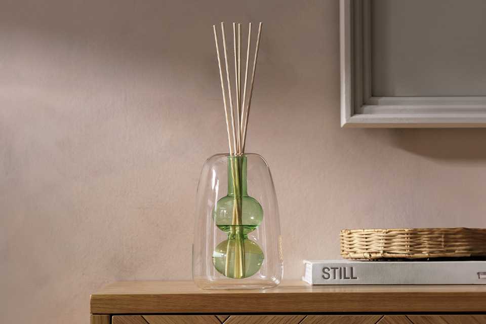Habitat Double walled bud vase glass diffuser vessel in green.