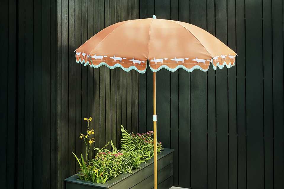 A Scion orange printed umbrella.