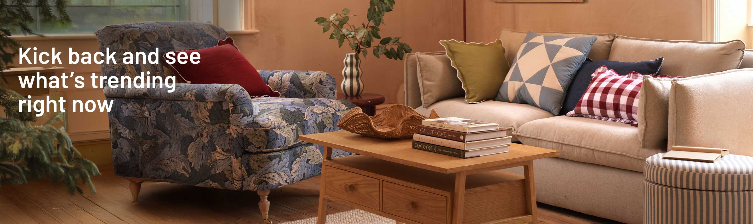 A coffee table with two drawers on a rug in front of a sofa in a living room and a country themed living room with natural colours and textures.