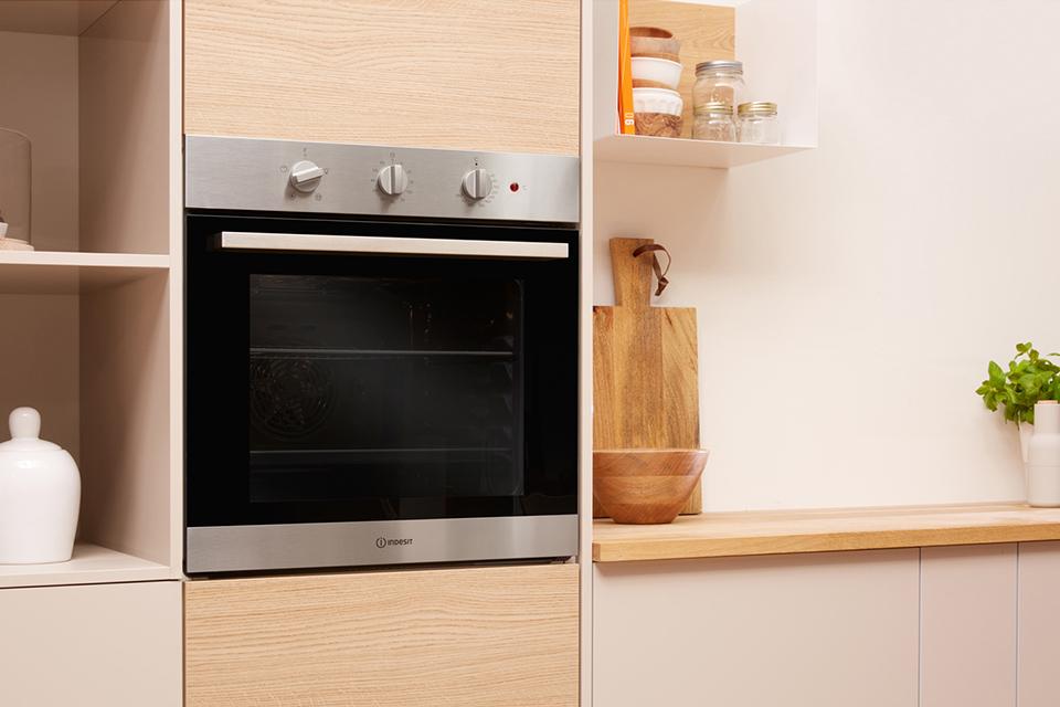Built-in eye-level single oven in a light kitchen setting.