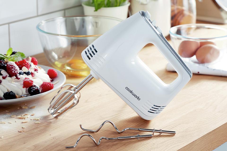 Hand mixer on kitchen side.