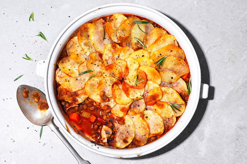 Cooked cottage pie in dish.