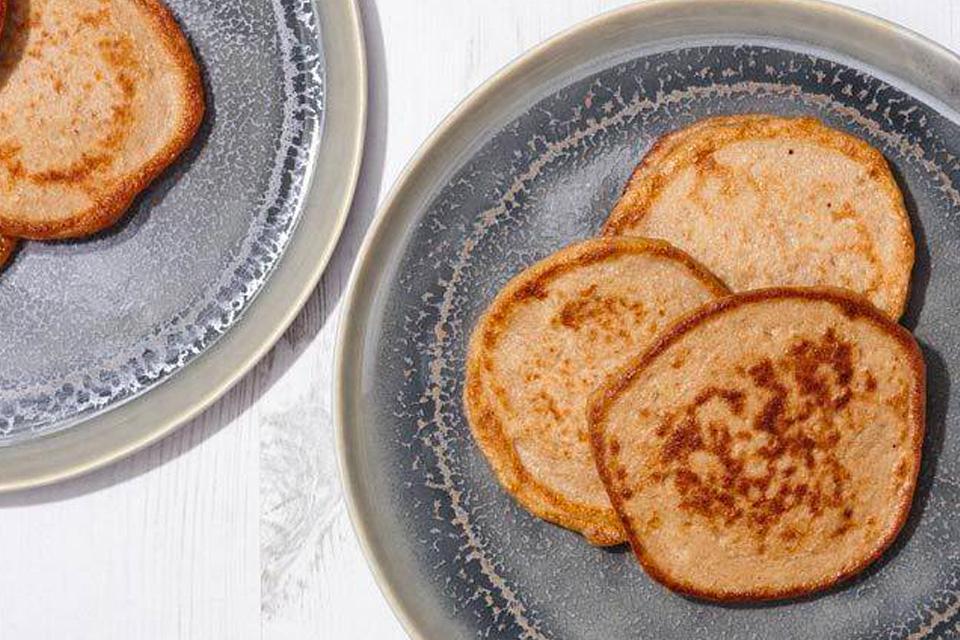 3 cooked pancakes on a plate.