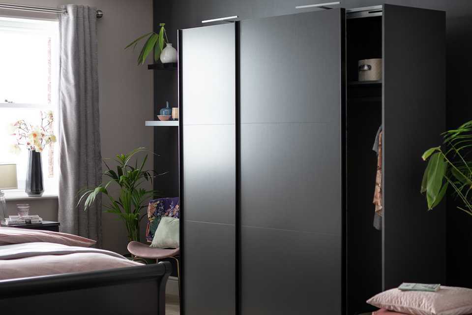 Black wardrobe in bedroom