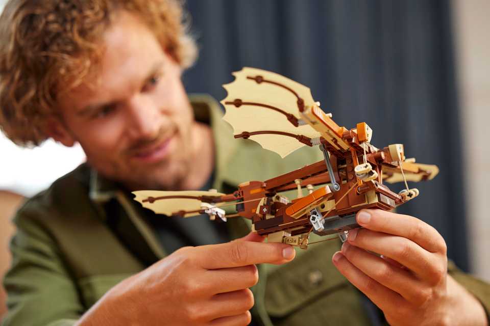 Man playing with the LEGO® Icons Leonardo da Vinci’s Flying Machine set.