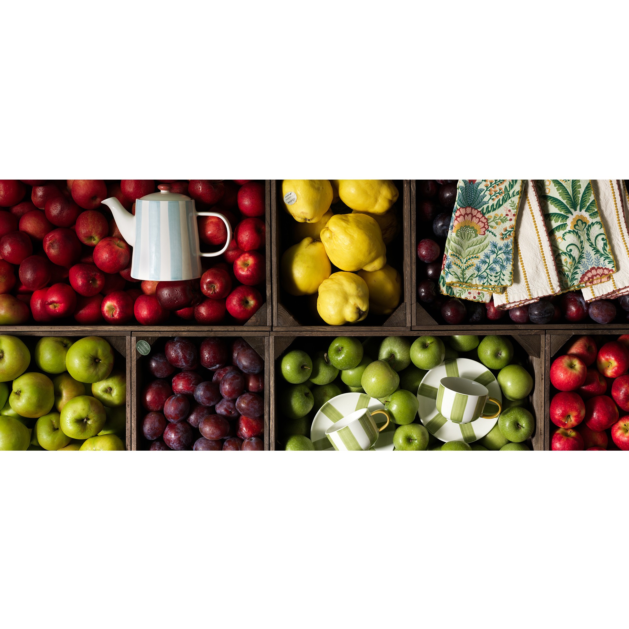 Habitat x Natonal trust banner with logo layered on top of image of a table with National trust printed table cloth with green frills around edge and dining chair at side of table with red walls.